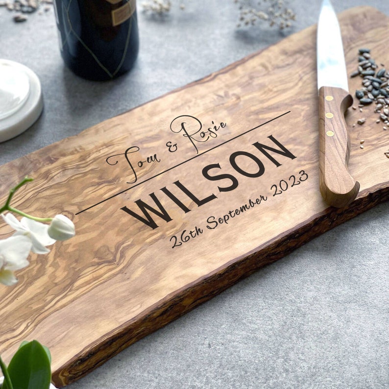 A beautifully designed, unique and custom engraved personalized gift. Crafted from rustic olive wood and ideal to use as chopping, serving, charcuterie or antipasti board, made from sustainable, natural olive wood.