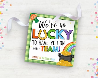 May include: A green and white checkered card with a leprechaun, rainbow, pot of gold, and the text "We're so LUCKY to have you on our TEAM! Happy St. Patricks Day!"