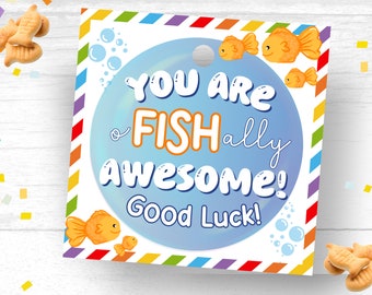 May include: A blue and white card with the text "You are Fishally Awesome! Good Luck!" and a cartoon goldfish. The card has a rainbow border.