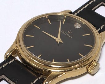 Vintage Bulova Gold Watch with Black Dial and Diamond Marker