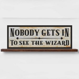 Nobody Gets In To See The Wizard Sign
