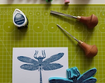 Hancarved stamp of a dragonfly