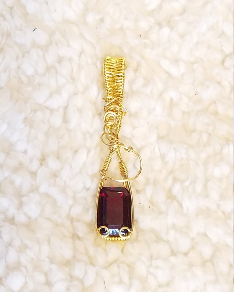 Faceted 10x14mm Garnet in Gold Toned Copper