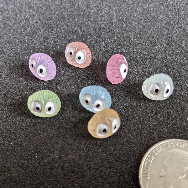 Tiny glow in the dark monsters with big eyes