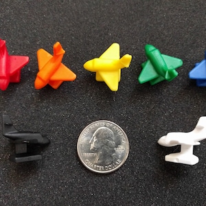 Plastic airplane board game piece.