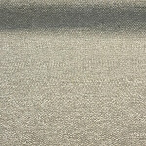 May include: A close-up of a textured, light gray fabric with a subtle sheen.