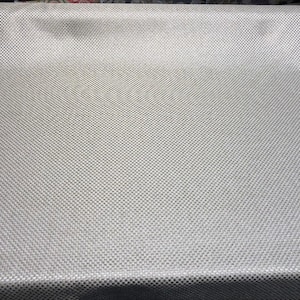 May include: A close-up of a silver fabric with a textured, woven pattern.