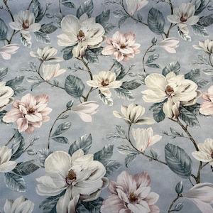 May include: A blue fabric with a white and pink floral pattern. The flowers are large and have a realistic look. The fabric is perfect for upholstery or curtains.