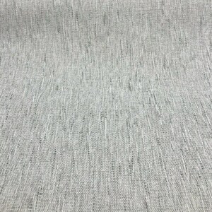May include: Close-up of a light gray fabric with a subtle woven texture.