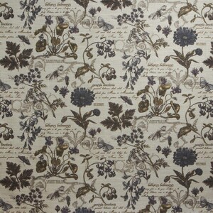 May include: A beige fabric with a repeating pattern of dark green, brown, and purple flowers and leaves. The fabric has a vintage look and includes text such as "Daucus Caro", "Genista Tinctoria", "Lathyrus Belinensis", and "Saintpaulia".