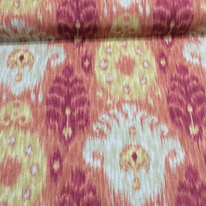 May include: Red, orange, and cream patterned fabric with an ikat design.