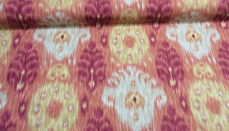 May include: Red, orange, and cream patterned fabric with an ikat design.