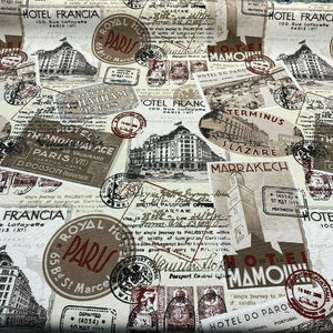 May include: A vintage-style fabric featuring a repeating pattern of Parisian hotel and travel stamps. The fabric is beige with brown, red, and black accents. The text on the stamps includes "Hotel Francia", "Royal Hotel Paris", "Terminus", "Slazare Marrakech", and "Hotel Do Paro".