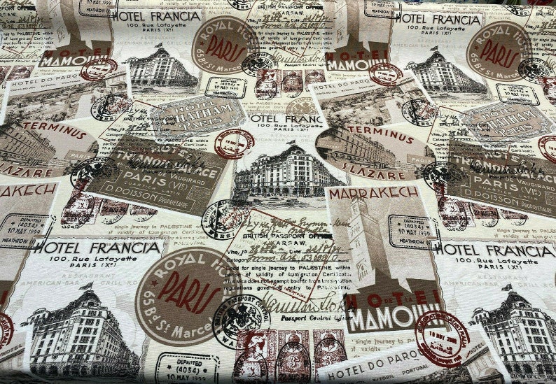 May include: A vintage-style fabric featuring a repeating pattern of Parisian hotel and travel stamps. The fabric is beige with brown, red, and black accents. The text on the stamps includes "Hotel Francia", "Royal Hotel Paris", "Terminus", "Slazare Marrakech", and "Hotel Do Paro".