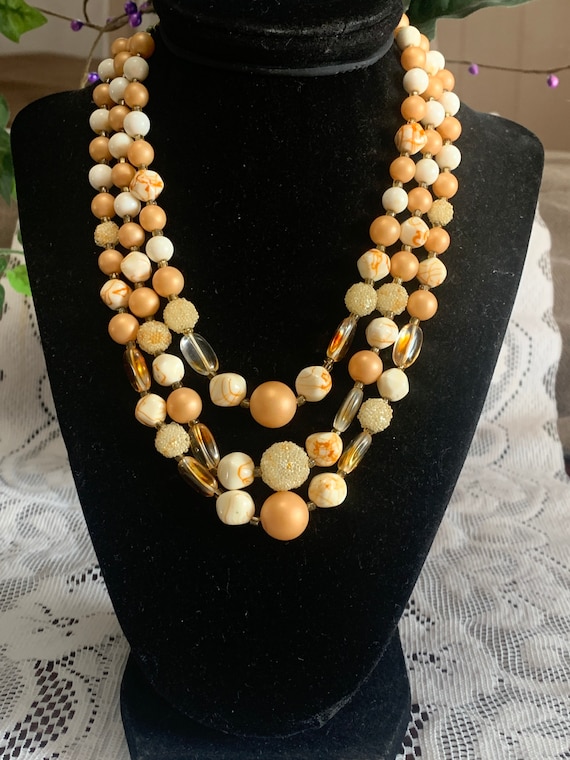 Peach and Sugar Beads  Three Strand Necklace. Sign