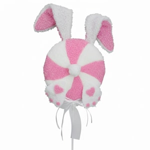 May include: A whimsical Easter decoration featuring a plush bunny design. The decoration has a round, striped body in pink and white, with fluffy white ears and bunny feet. A white ribbon and stick complete the design. The overall theme is Easter and spring.