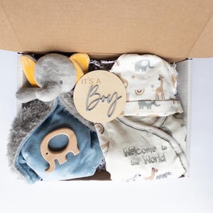 May include: A handmade, wooden serving tray with a natural finish. The tray features a rectangular shape with rounded corners and two carved handles. The wood grain is visible, adding to its rustic charm. Dimensions are approximately 16 inches long and 10 inches wide.