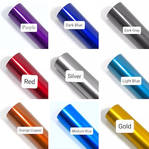 May include: Nine different colors of vinyl wrap rolls, including purple, dark blue, dark gray, red, silver, light blue, orange copper, medium blue, and gold.
