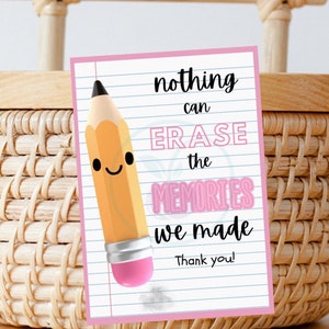 May include: A pink and white card with a cartoon pencil and the text "nothing can ERASE the MEMORIES we made Thank you!"