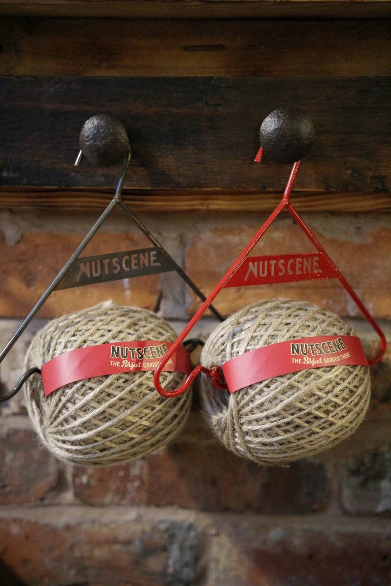 GARDEN TWINE HANGER : Nutscene twine ball on a decorative metal dispenser 