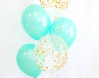 11" Mint and clear gold confetti balloons. Mint and gold. Mint balloons. Gold confetti balloons. Mint and gold balloons. Mint latex
