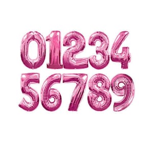 May include: Pink foil number balloons, 0 through 9, for a birthday party or other celebration.