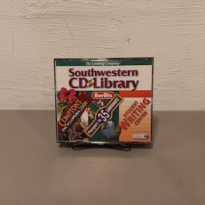 May include: A Southwestern CD Library case with five CDs. The case features logos for Compton's Encyclopedia 2000, Berlitz Passport to 35 Languages, and Student Writing Center.