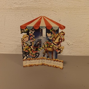 Vintage 3D-carrouselwenskaart voor verjaardag van de jaren 1950