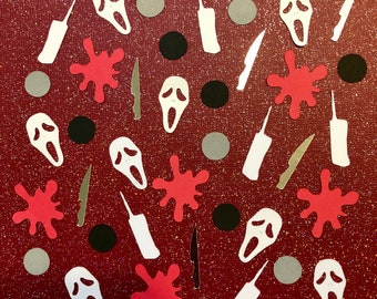 May include: A red glitter background with scattered Halloween-themed cutouts. The cutouts include white ghost face masks, silver knives, white walkie-talkies, red blood splatters, black circles, and gray circles.