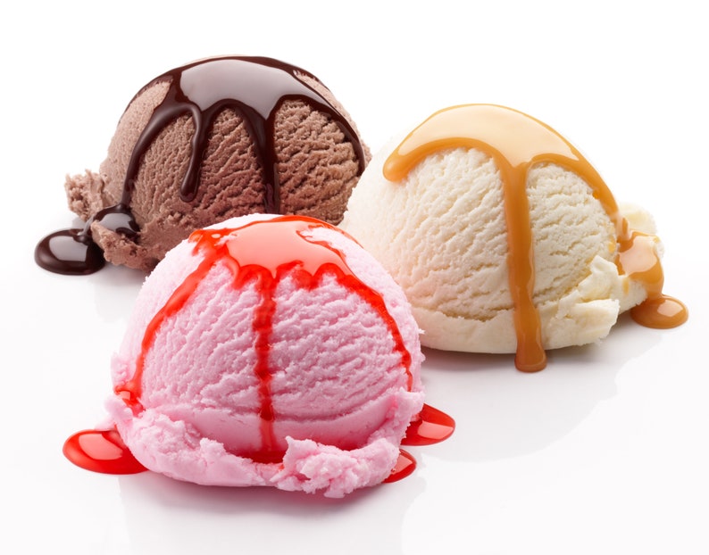 May include: Three scoops of ice cream, one chocolate with chocolate sauce, one vanilla with caramel sauce, and one strawberry with strawberry sauce.