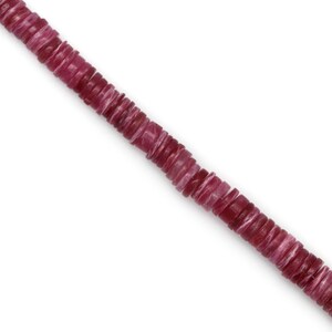 May include: A strand of pink and white gemstone beads. The beads are round and flat, and they are strung on a clear thread.