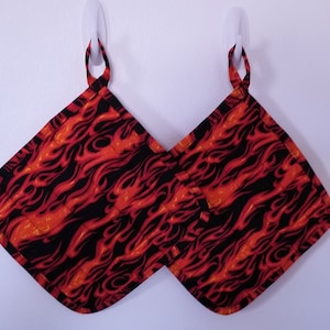 Set of two 9&quot; quilted handmade pot holders or one 9&quot; pot holder with a oven mitt with a flame design. Nice gift for someone who likes to BBQ
