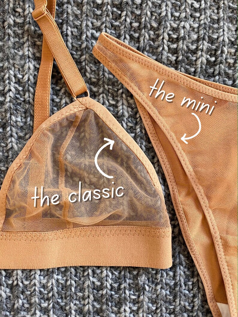 May include: Two nude-colored lingerie tops, one a classic triangle style and the other a mini style. The classic style has a mesh overlay and the mini style is a solid fabric.