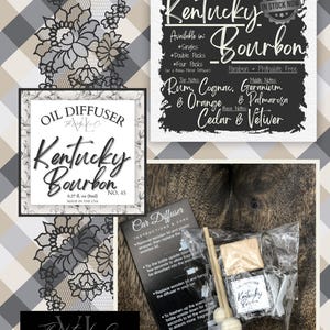 May include: An image showcasing a Kentucky Bourbon oil diffuser set. The set includes a car diffuser with instructions, a small bottle, and wooden sticks. The packaging features the text "Kentucky Bourbon" and scent notes. The background has a plaid pattern.