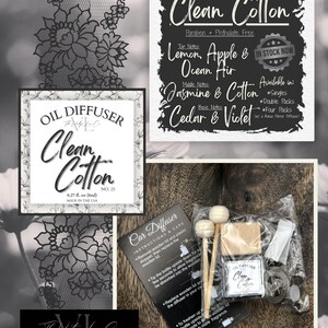 May include: An assortment of Clean Cotton oil diffusers and car diffusers. The image includes a sign with fragrance notes, a bottle, wooden sticks, and a car diffuser kit. The text reads "Clean Cotton" and "Made in the USA."