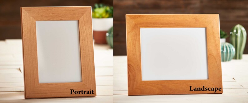 May include: Two wooden picture frames, one portrait and one landscape, with a light brown finish. The frames have a white interior and are displayed on a light-colored surface. The word "Portrait" is printed on the portrait frame, and "Landscape" is printed on the landscape frame.