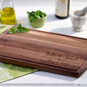 Custom engraved cutting board for the couple, Arched walnut 16x10 in