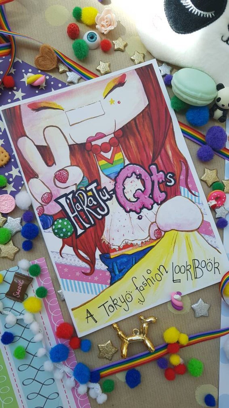 May include: A colorful book cover with a cartoon illustration of a girl with red hair and a peace sign. The book title is "Harajuku QTs" and the subtitle is "A Tokyo fashion LookBook".