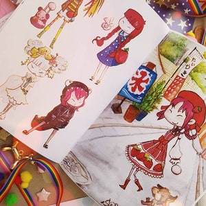 May include: An open sketchbook with colorful illustrations of cartoon characters. The characters are drawn in a whimsical style with bright colors and detailed features. The sketchbook is open to a page with a character wearing a red dress and a strawberry pattern. The page also includes the word "September" written in cursive.