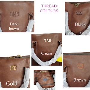 May include: A close-up of six brown leather tote bags with different colored thread. The bags have different initials embroidered on them. The thread colors are: dark brown, black, cream, gold, royal blue, and brown.