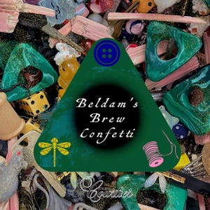 May include: A green triangle with the text "Belldam's Brew Confetti" in white. The triangle is surrounded by a variety of colorful trinkets and toys, including a dragonfly, a spool of thread, and dice.