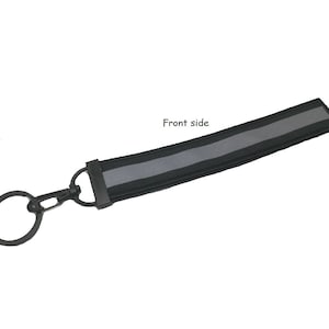 Llavero reflectante negro para motociclista, seguridad de carreras, llavero con etiqueta de color negro reflectante, 2,5X15 CM