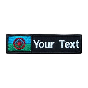 May include: Black and green embroidered patch with a blue, green, and red flag and the text "Your Text" in white.