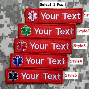 May include: Five red embroidered patches with different coloured medical symbols and the text "Your Text" in white. The patches are labelled "Style 1" through "Style 5".