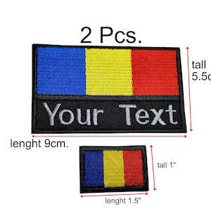 May include: Two black embroidered patches. The larger patch is 9 cm long and 5.5 cm tall, with blue, yellow, and red stripes and the text "Your Text". The smaller patch is 1.5 inches long and 1 inch tall, with the same design.
