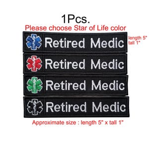 May include: Four rectangular black embroidered patches, each measuring 12.7 cm long by 2.54 cm tall. Each patch features the white text 'Retired Medic' next to a Star of Life symbol in blue, red, green, or black with a white serpent and staff.