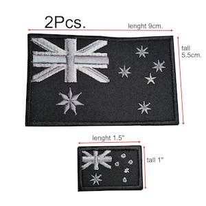 May include: Two black embroidered patches featuring the Australian flag. The larger patch measures 9 cm in length and 5.5 cm in height. The smaller patch is 1.5 inches long and 1 inch tall.