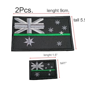 May include: Two black and green embroidered Australian flag patches. The larger patch is 9 cm long and 5.5 cm tall. The smaller patch is 1.5 inches long and 1 inch tall.