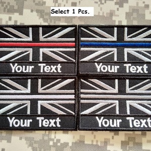 May include: Four black embroidered patches with the Union Jack flag design. Each patch has a thin colored stripe across the flag and the text "Your Text" below. The stripes are red, blue, white, and white.