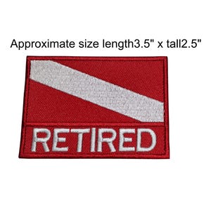 May include: Red and white scuba diver flag patch with the word "RETIRED" embroidered in white. The patch is approximately 3.5 inches long and 2.5 inches tall.